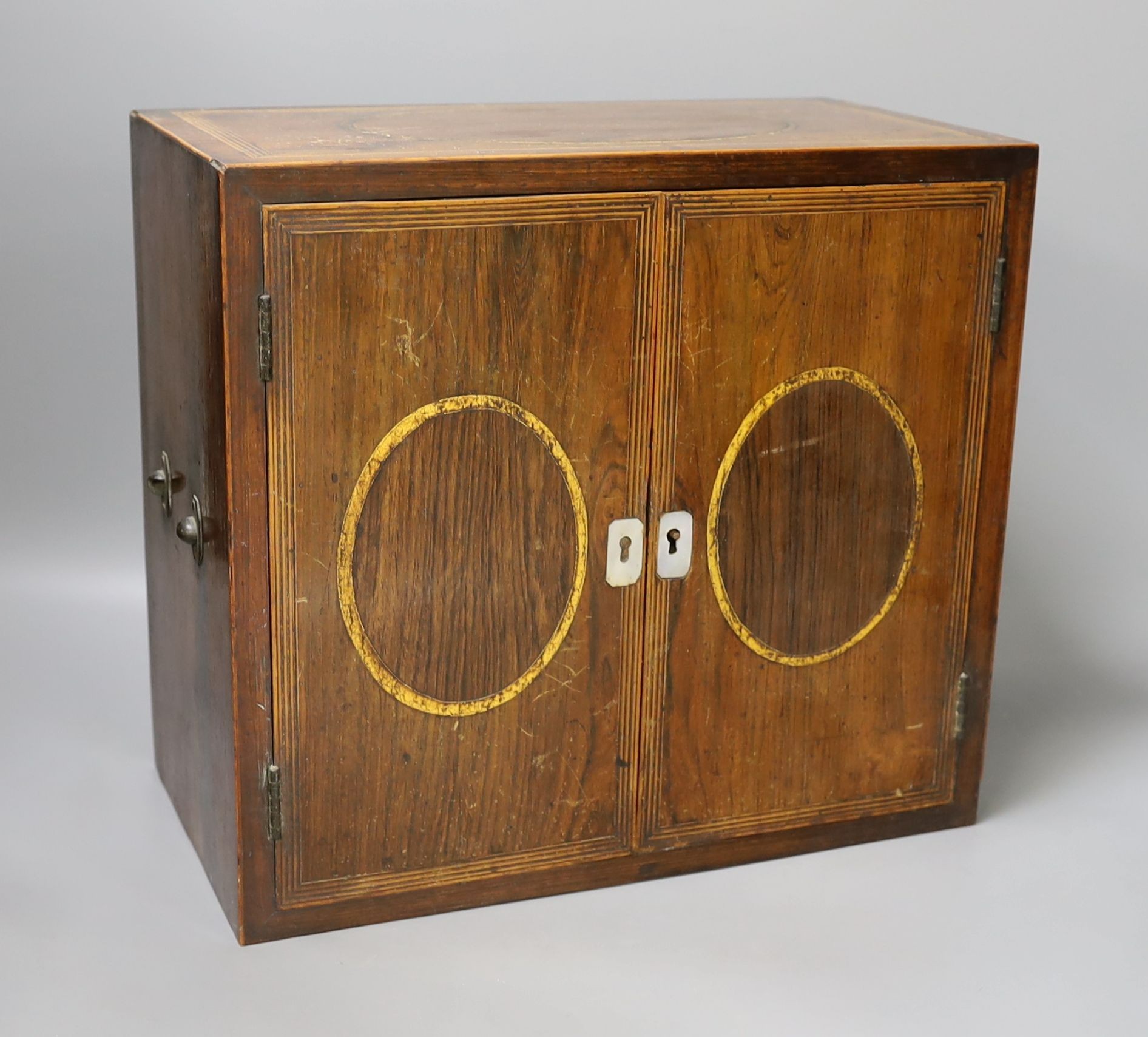 A Regency brass inlaid rosewood table cabinet, fitted with five drawers - 30cm tall